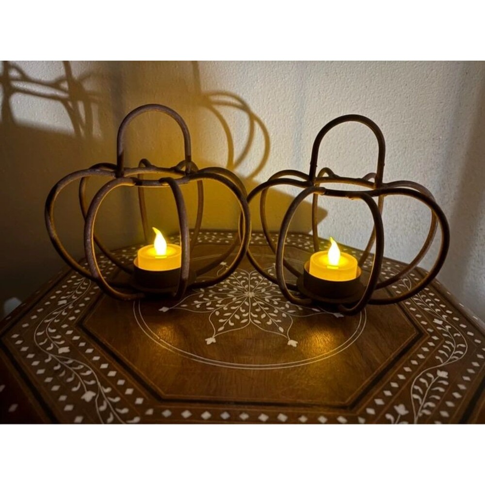 Pair of metal pumpkin tea light holders